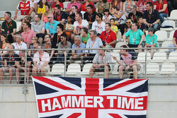 A union flag with Hammer Time written on it with the fans in the grandstand