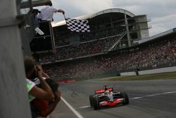 Lewis Hamilton takes the checkered flag