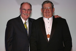 NASCAR Vice President of Corporate Communications Jim Hunter presents former NASCAR Sprint Cup Series driver Donnie Allison with his International Motorsports Hall of Fame medal