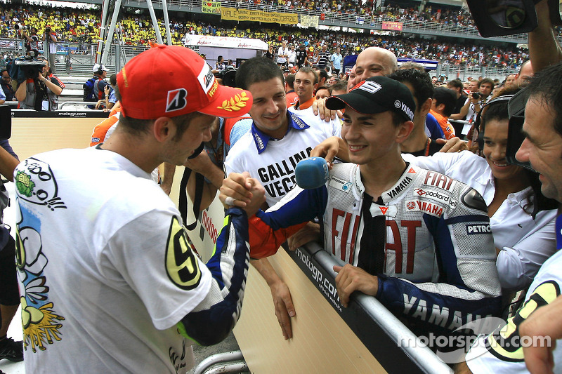 2009 MotoGP champion Valentino Rossi, Fiat Yamaha Team celebrates with Jorge Lorenzo